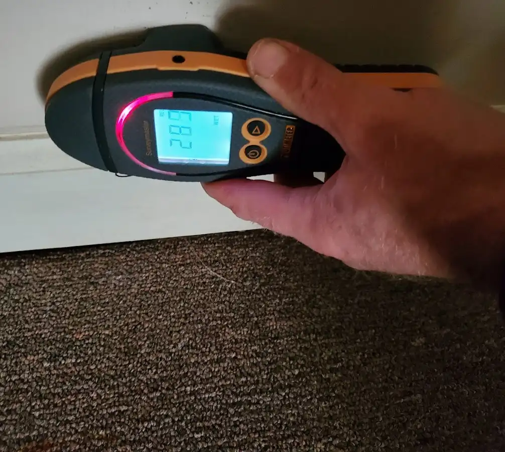 Moisture detection at baseboard during Storm Damage Restoration in East Goshen